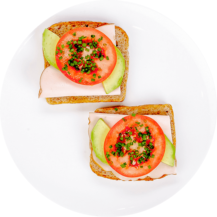 Sandwich with ham, avocado, tomato and chives