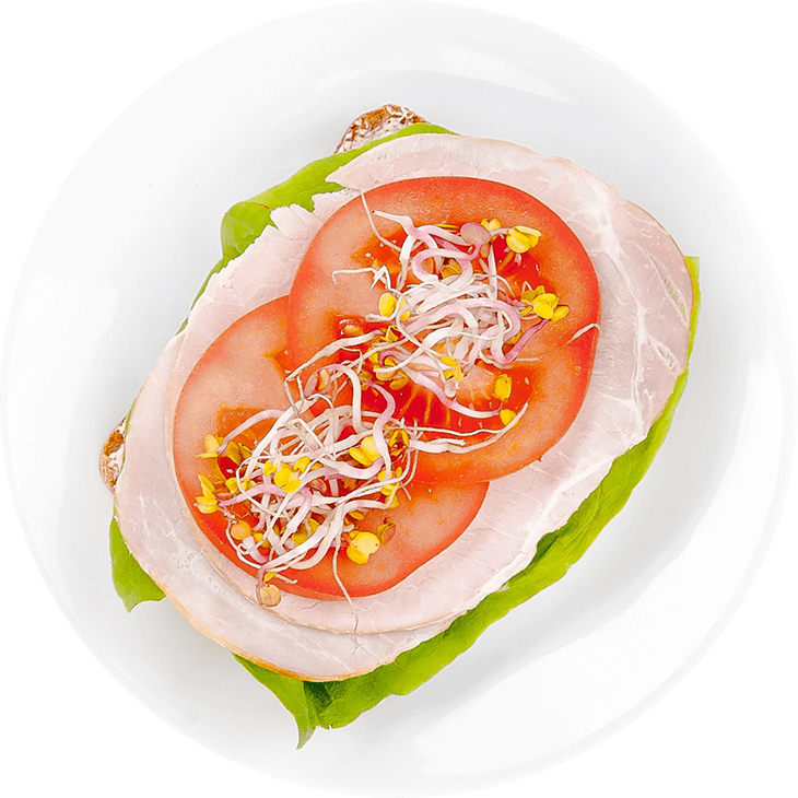 Sandwich with pork chop, tomatoes and sprouts