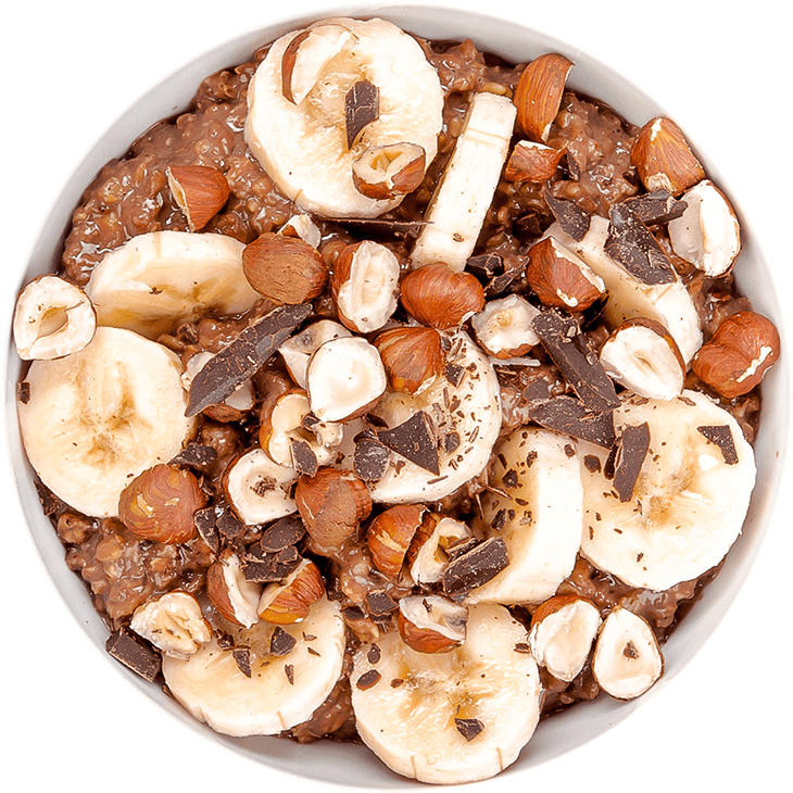Porridge with milk, banana, hazelnuts and cocoa powder