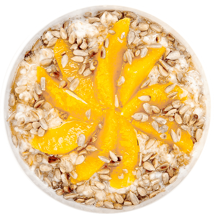 Porridge with milk, orange and sunflower seeds