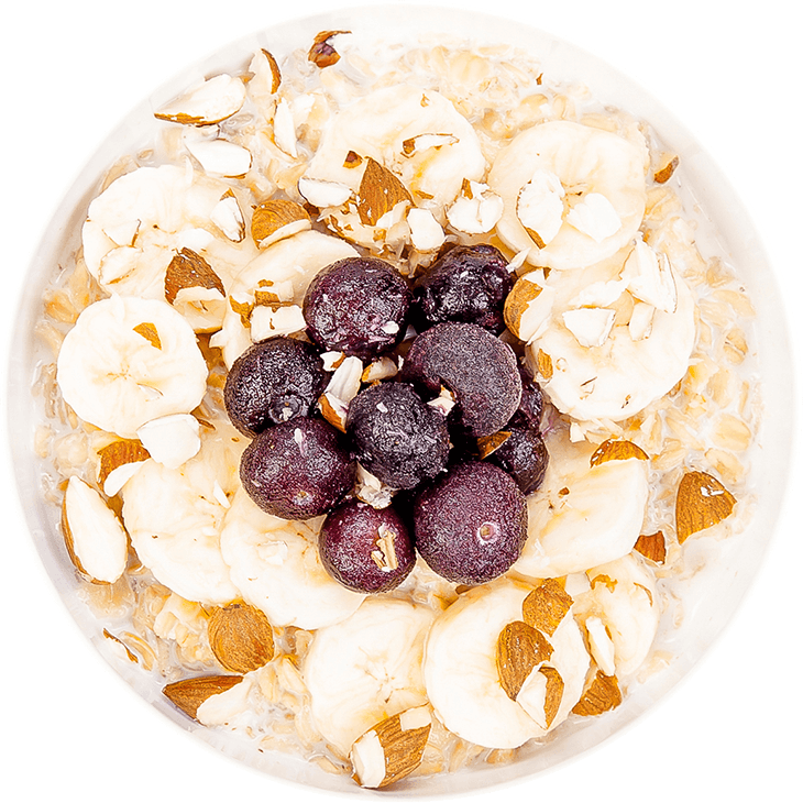 Porridge with milk, banana, blueberries, almonds and cocoa powder