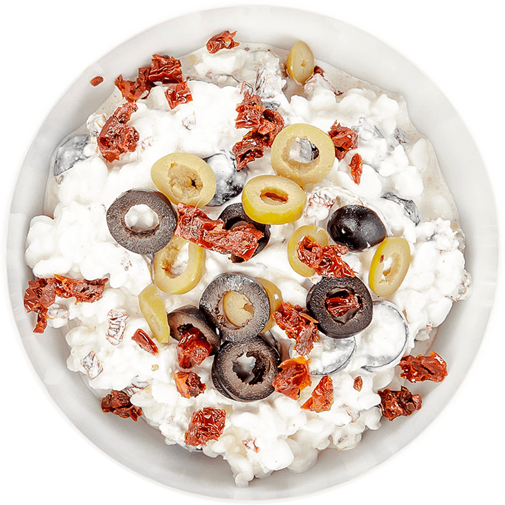 Cottage cheese with dried tomatoes, olives and almonds