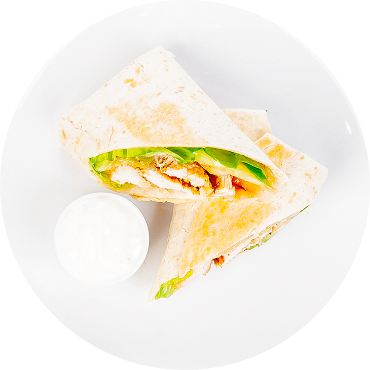 Tortilla wrap with chicken, lettuce, cucumber, tomato, pepper and garlic sauce