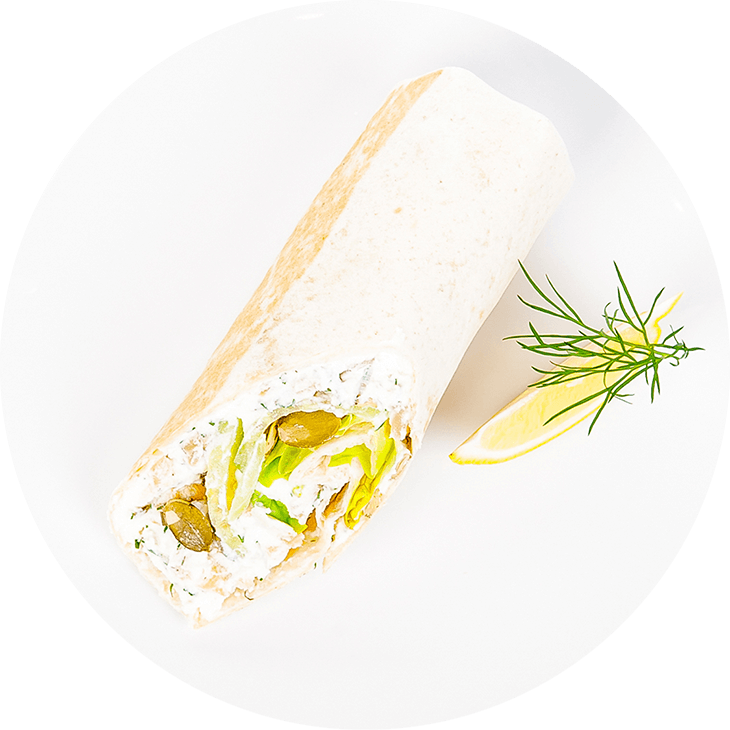 Tortilla wrap with smoked salmon, ricotta, lettuce and a cucumber