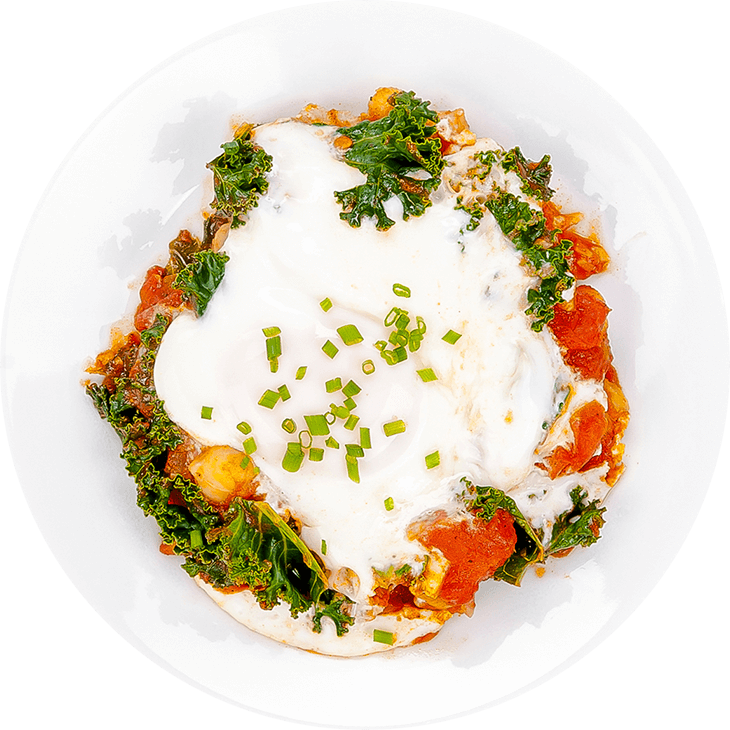 Eggs in tomato sauce with kale and chickpeas (shakshuka)